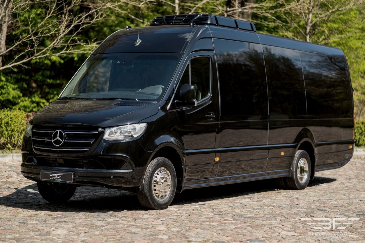 Black Sprinter minibus on a cobbled square